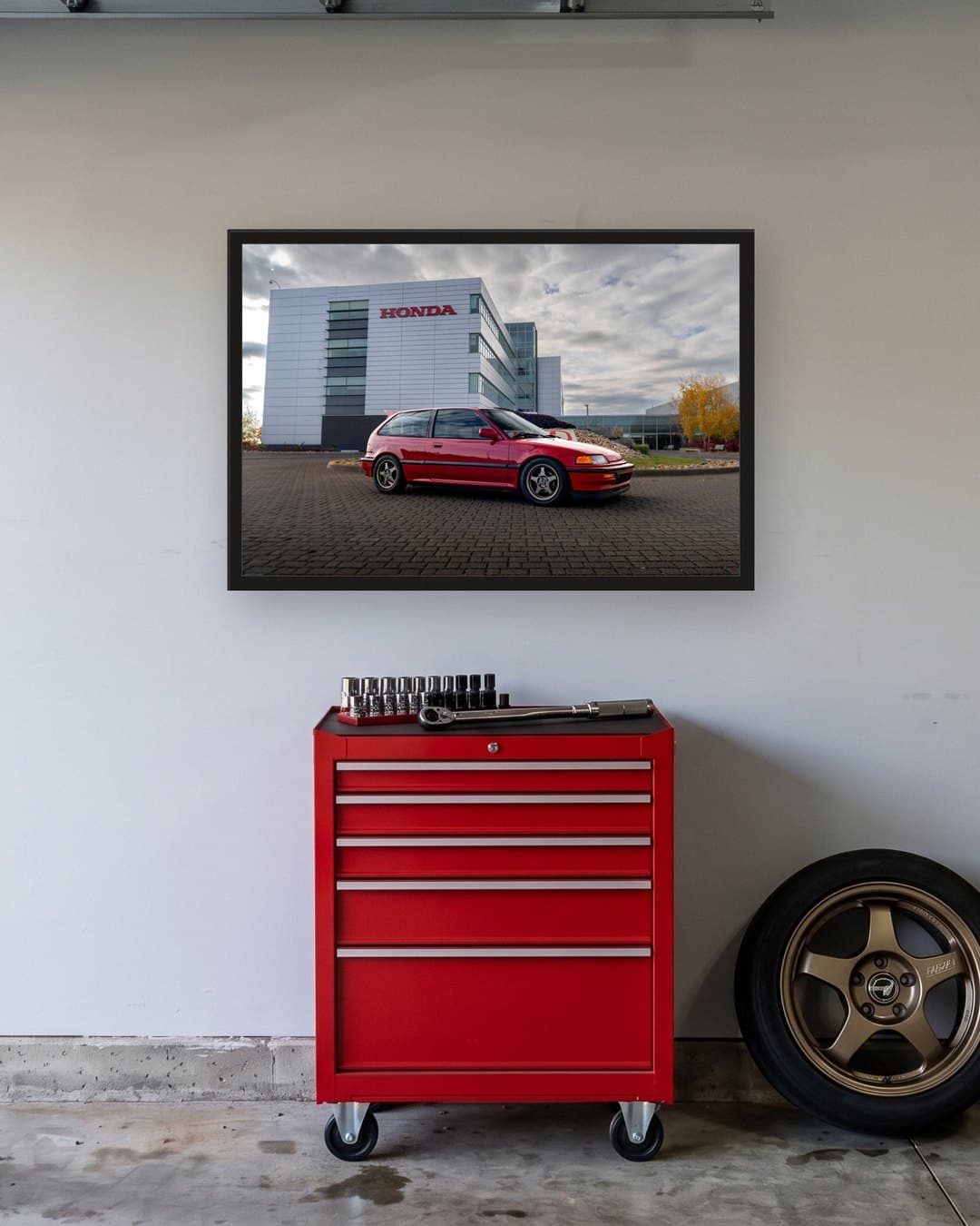 The 36 x 24 print hung in a home garage above a tool chest